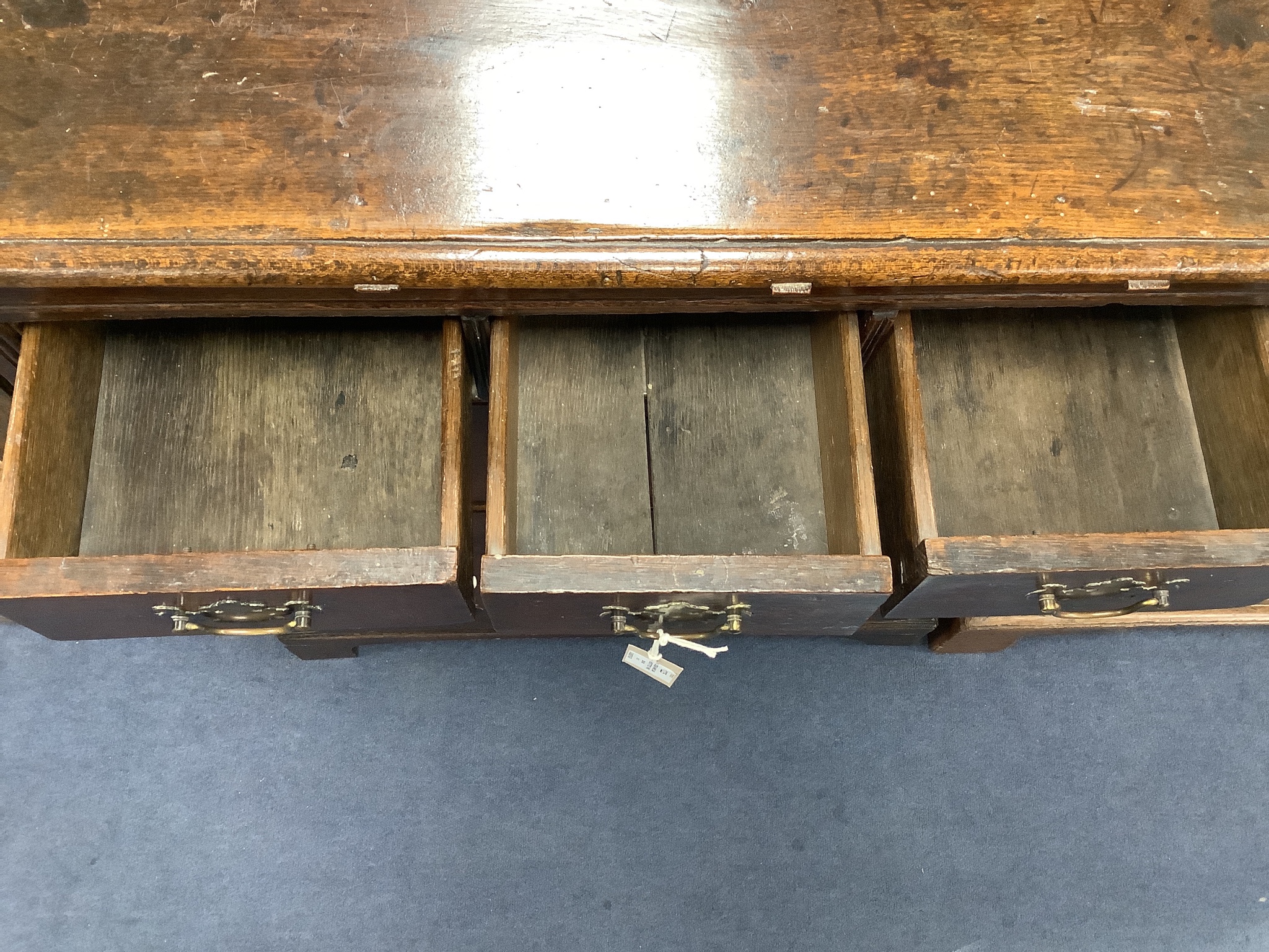 A Queen Anne oak chest fitted three short drawers and three long drawers, width 76cm, depth 49cm, height 98cm